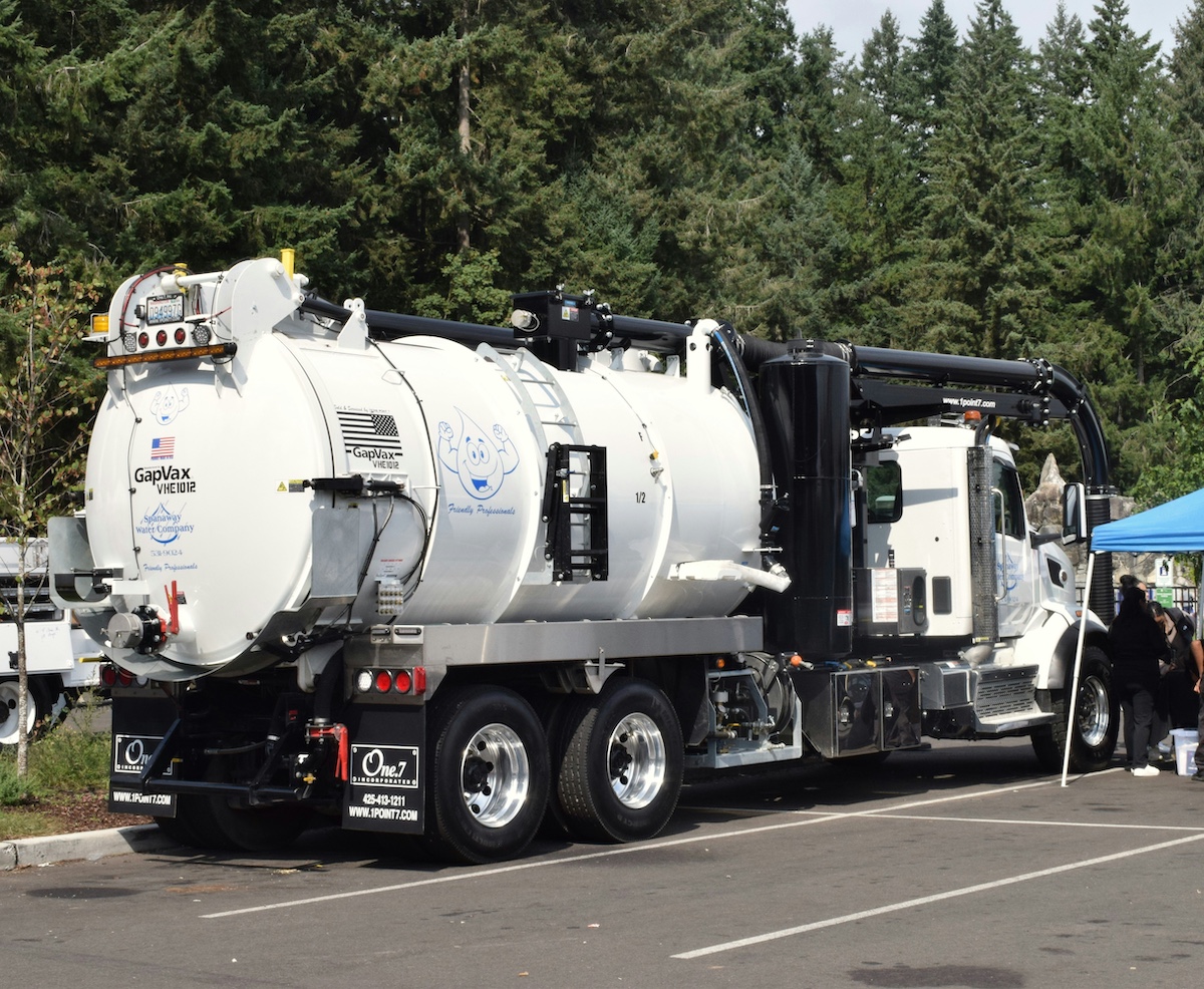 Septic pump truck servicing a wooded residential property in the Tennessee foothills